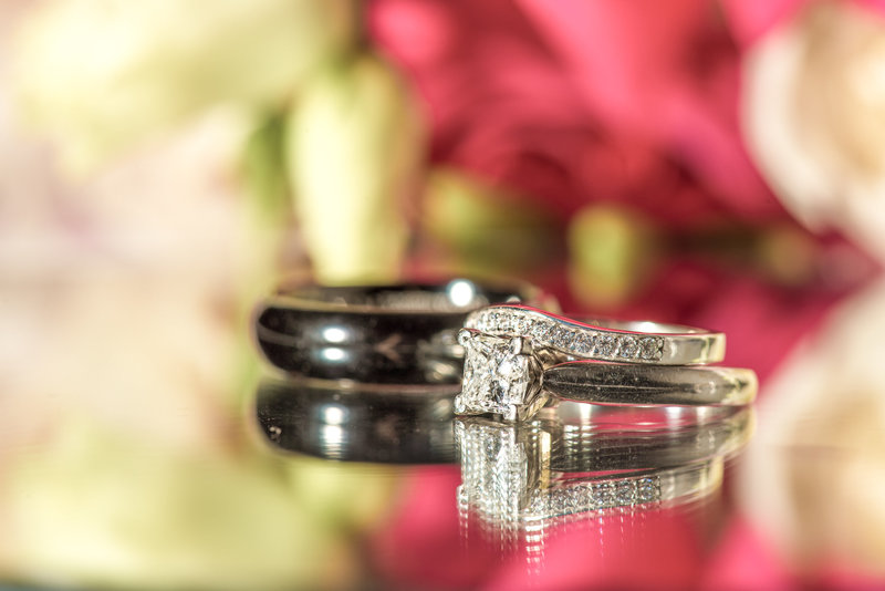 Wedding ring set in with black groom's ring