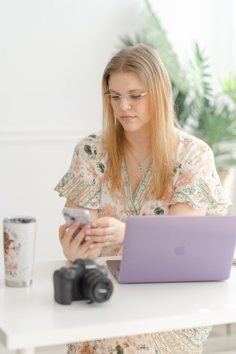 Woman on her phone during Manassas, Virginia branding pictures