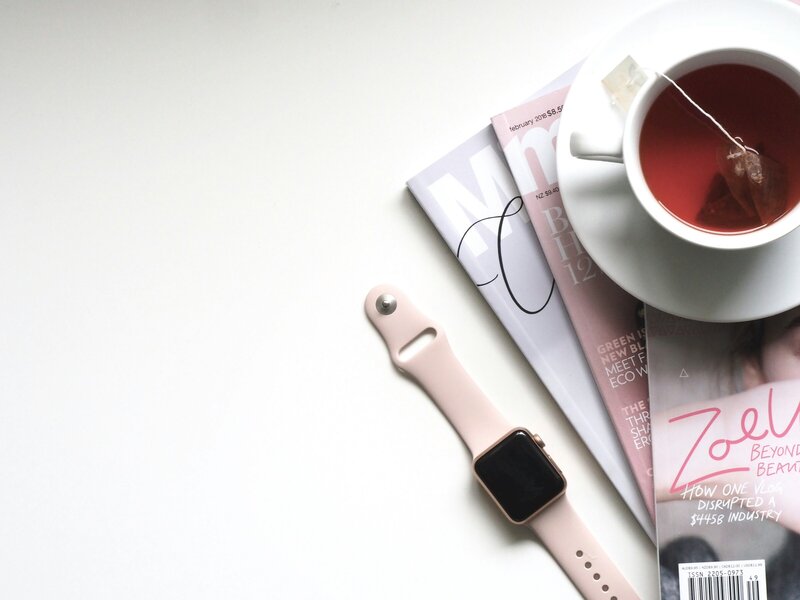 pink watch, tea & magazines