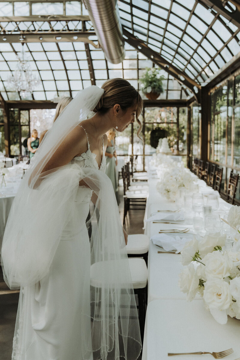 Bride looking at decorations by Galveston wedding planners, Water to Wine Events.
