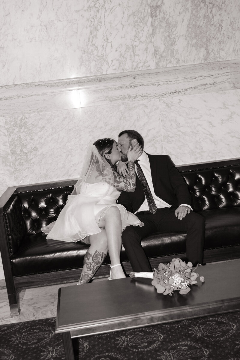 Modern Boise elopement with couple kissing inside Idaho Capitol Building