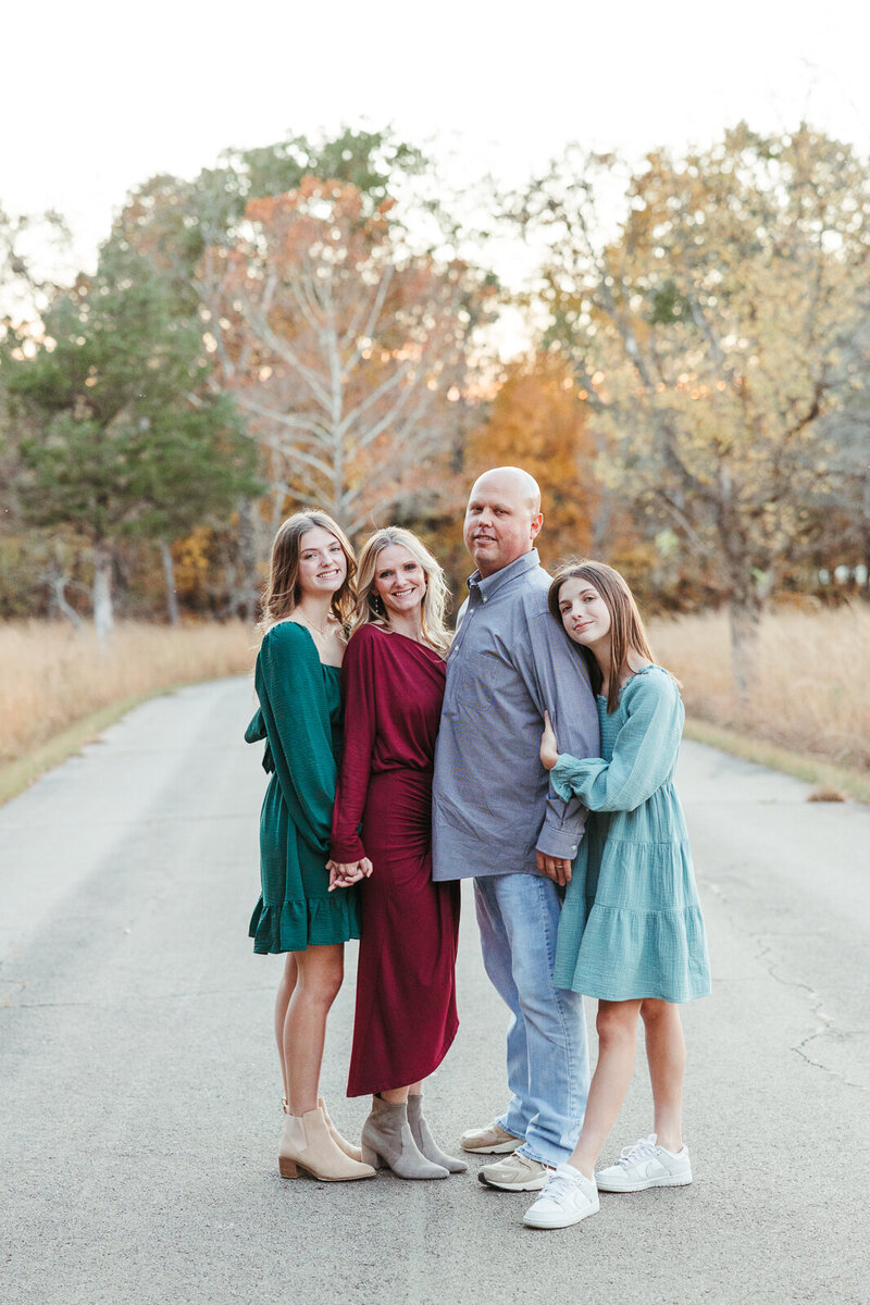 Family portrait taken at the park in the fall. 