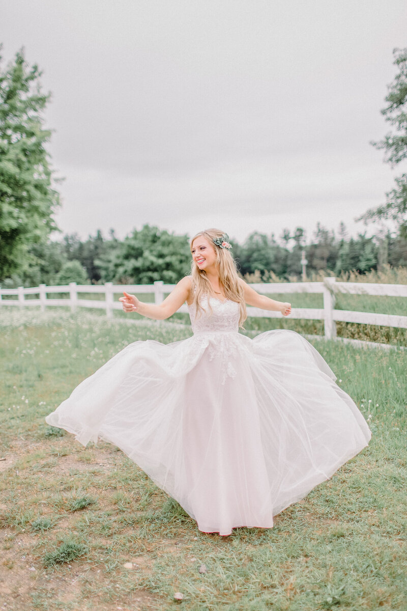 Bride in summer twirling her dress