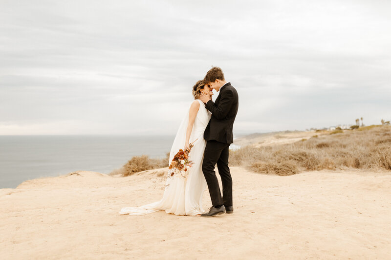bride and groom at cliffside wedding in Los Angeles