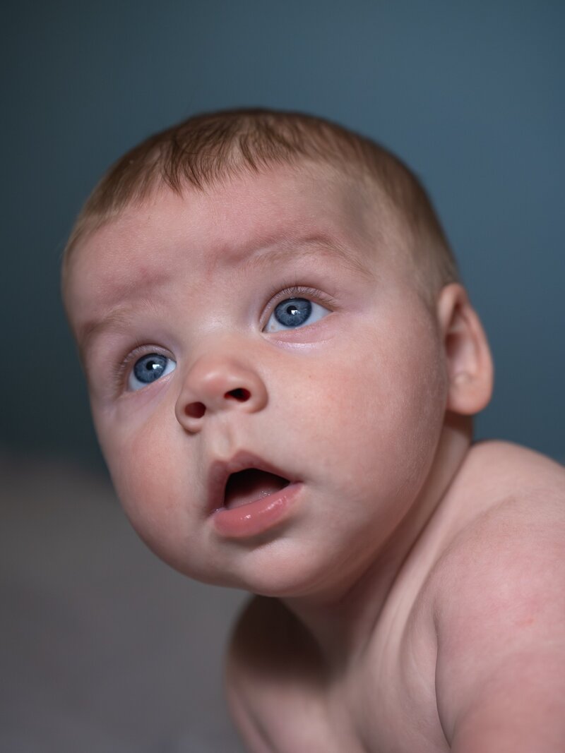 close up newborn portrait of a baby with blue eyes