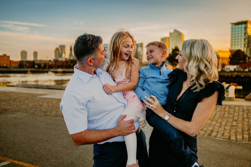 Family Portraits in Boston with the city in the background.