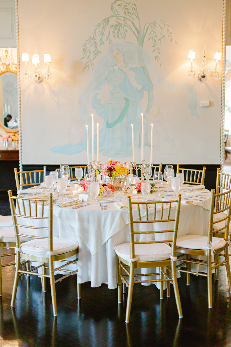 wedding table with gold chairs
