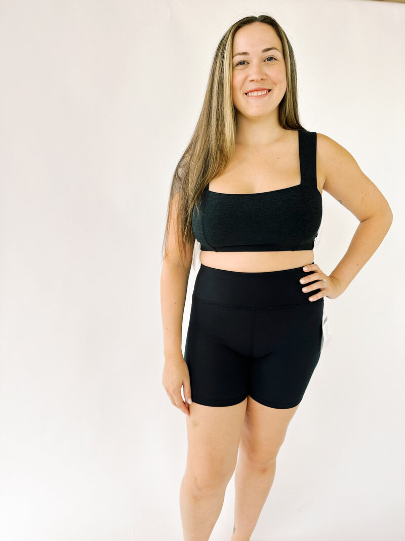 back of woman wearing blue square neck beyond yoga tank