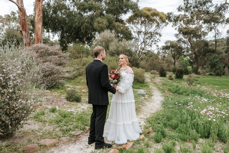 A bride and a groom eloping in the botanical gardens