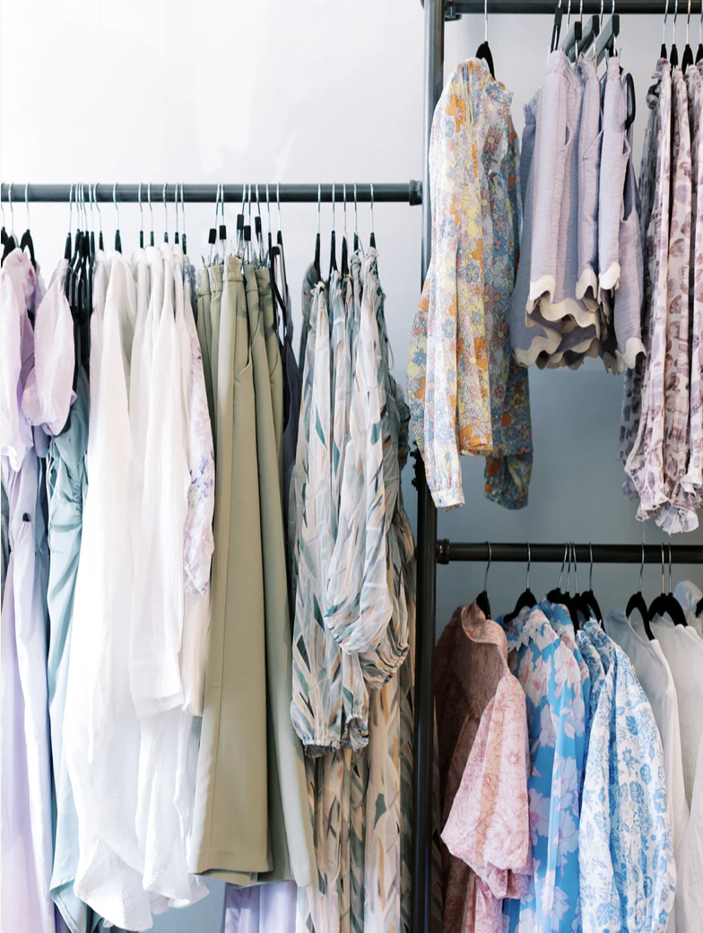 Racks of clothing on hangers