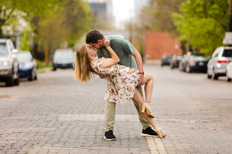 couple dipping in cobblestone street in german village ohio for engagement session