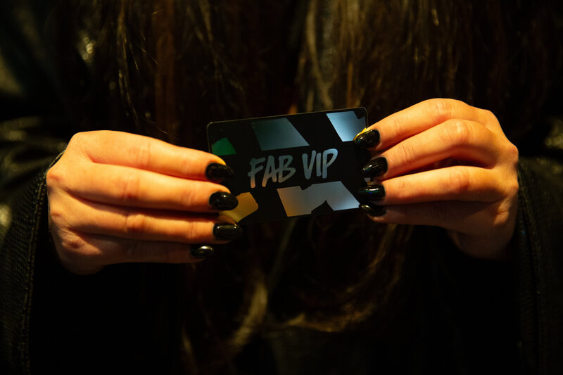 Personal trainer doing pull-ups on rings