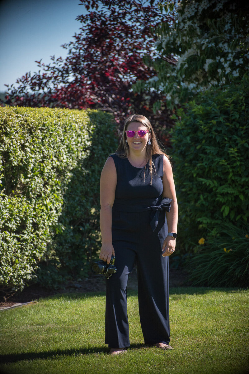 woman smiling taking a photo