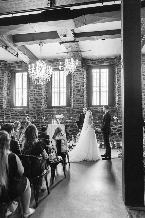 Wedding ceremony taking place at Auberge Saint-Gabriel in Old Montreal, one of the most emblematic Montreal wedding venues.