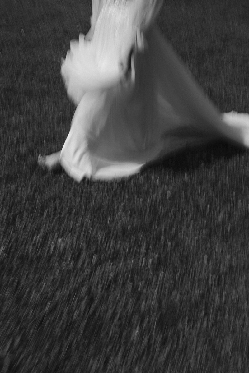 Photo of women running in wedding dress balck and white photography