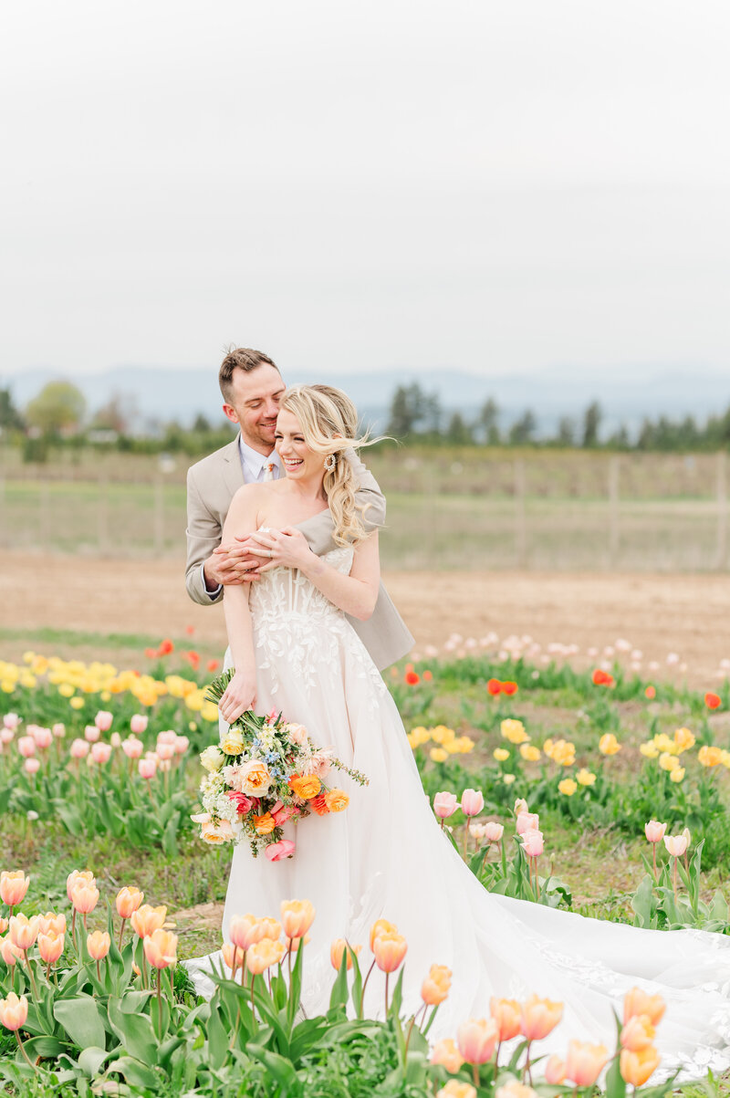 groom hugging bride in wedding venue in spokane washington called farmhouse on greenbluff 