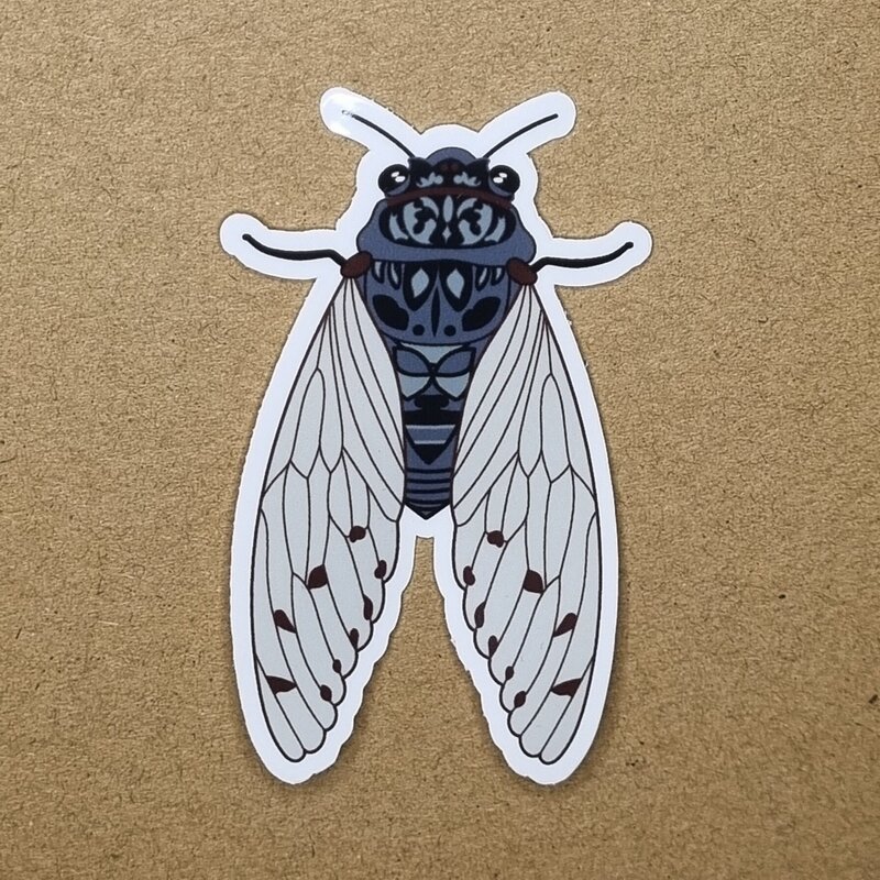 Celebrate the beauty of nature with this 75mm cicada sticker, featuring original artwork inspired by the intricate form of this iconic insect. Printed on durable, weatherproof vinyl and finished with a protective laminate, it’s designed to last—indoors or out. Perfect for decorating laptops, water bottles, notebooks, or outdoor gear, this sticker adds a touch of the wild wherever it's placed.