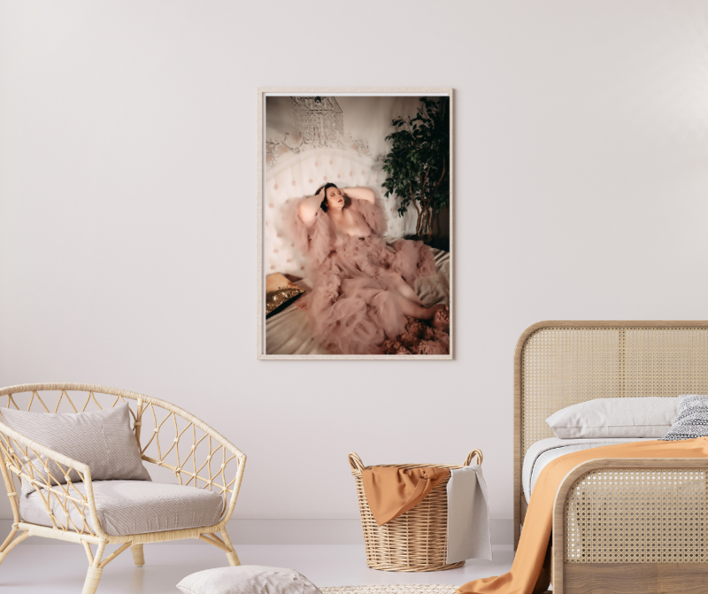 Wall art of a woman in sheer robe on a bed in a boudoir studio in Minneapolis Mn