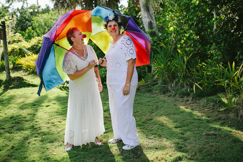Fun-Wedding-Portrait-Two-Brides-Rainbow-Umbrellas-Naples-LGBTQ-Wedding