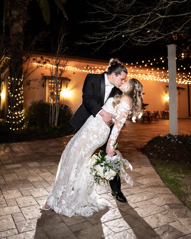 Portrait of bride and groom kissing at The Greystone wedding venue in Mandeville Louisiana