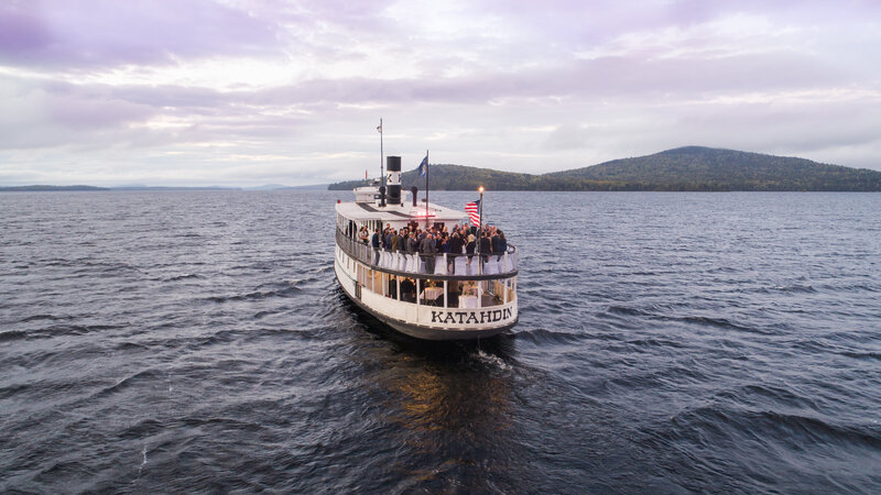 Aerial shot of the boat with land in the back | Aerial Wedding Photography