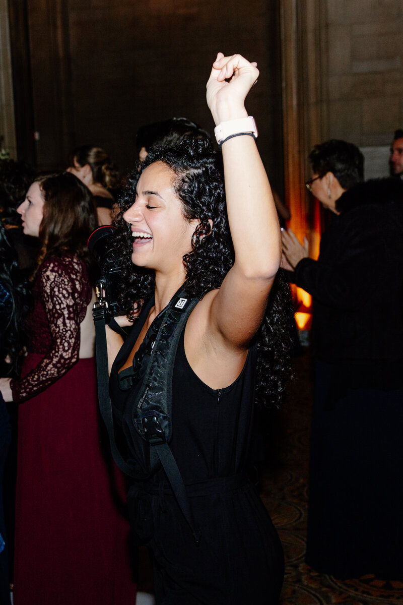 Photographer, Teresa Williams, dances during the wedding reception