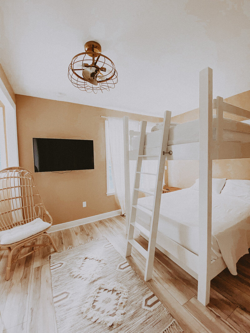 pink bedroom with white bunk bed