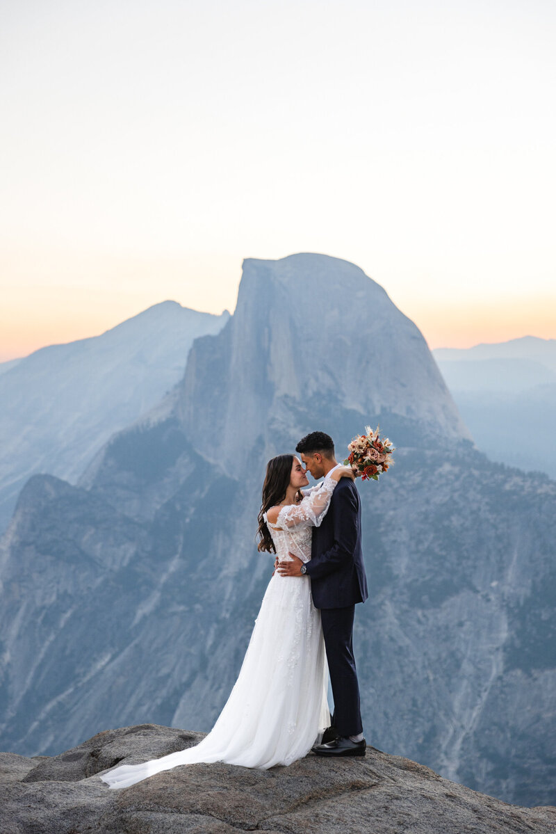 groom holding up bride
