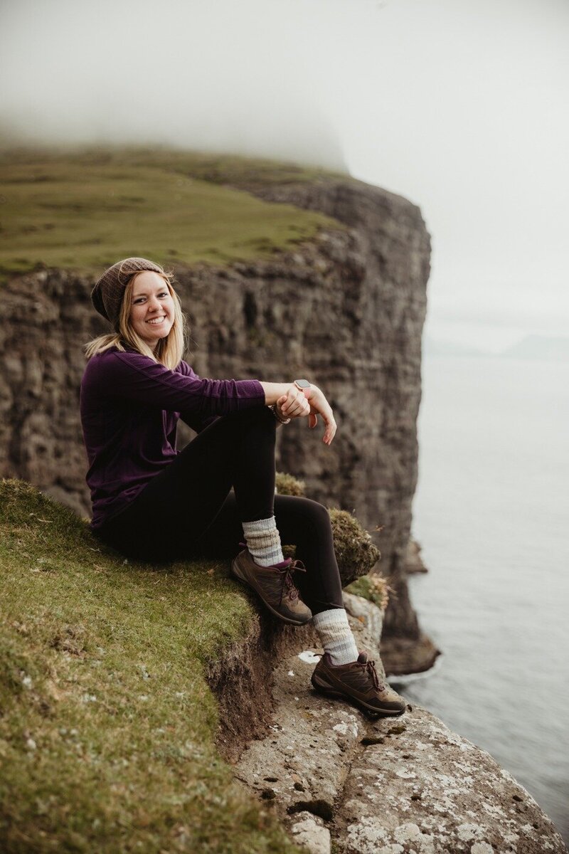 Elopement Photographer self portrait on top of a mountain on the Faroe Islands