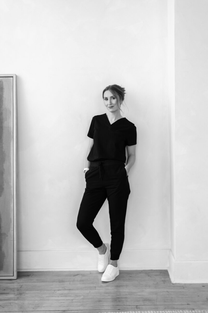 Leigh Anne, owner of Rove skin and wellness smiling and guiding a client through treatment options during a personalized consultation for botox and dermal filler injections and Sculptra injections.