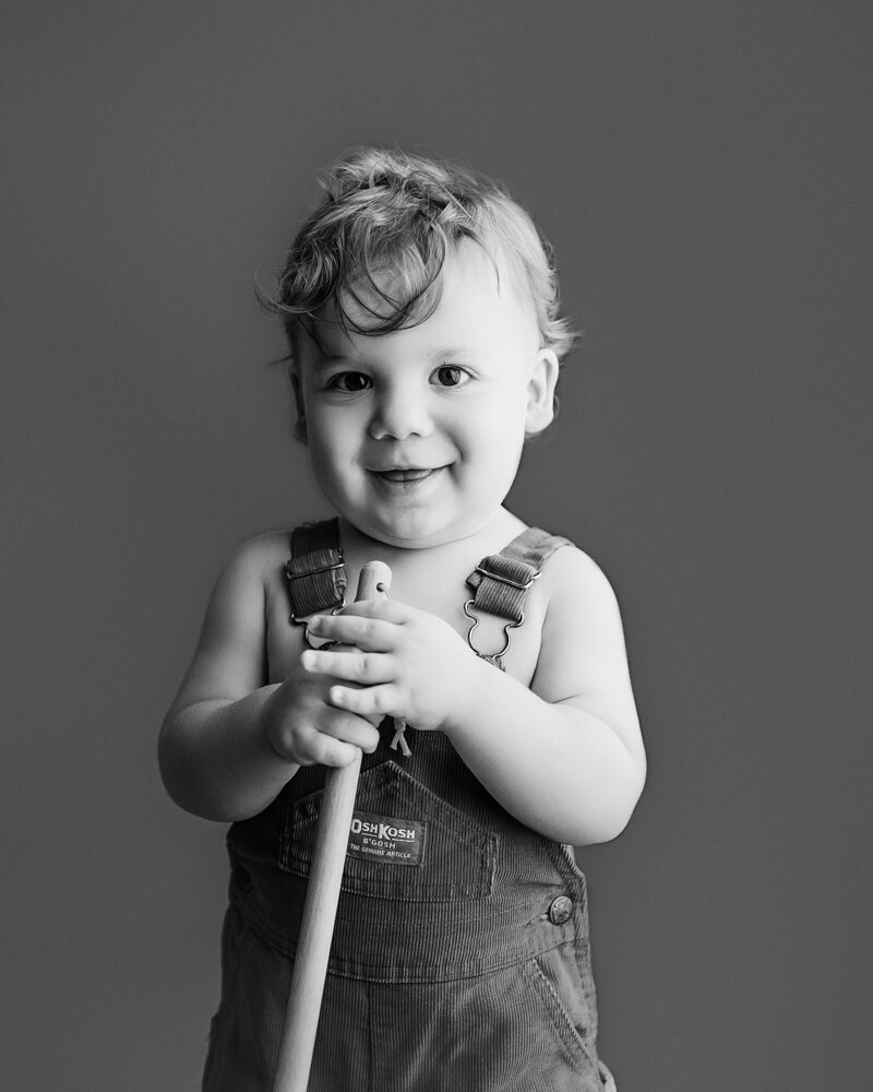 Close-up of baby giggling with joy during studio milestone session