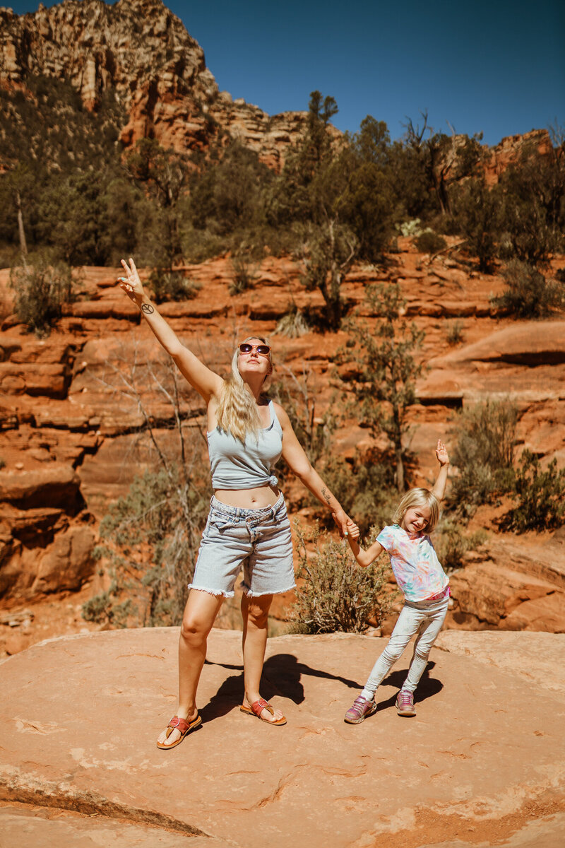 Christina Landini with her daughter with beautiful red rocks in the background in Sedona, Arizona.