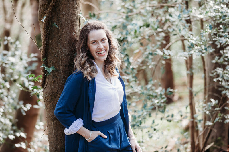 Dr Kate in a calming outdoor space, symbolizing natural healing and emotional balance