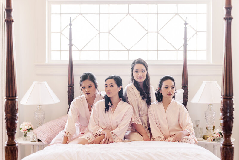 Bride with Bridesmaids on bed