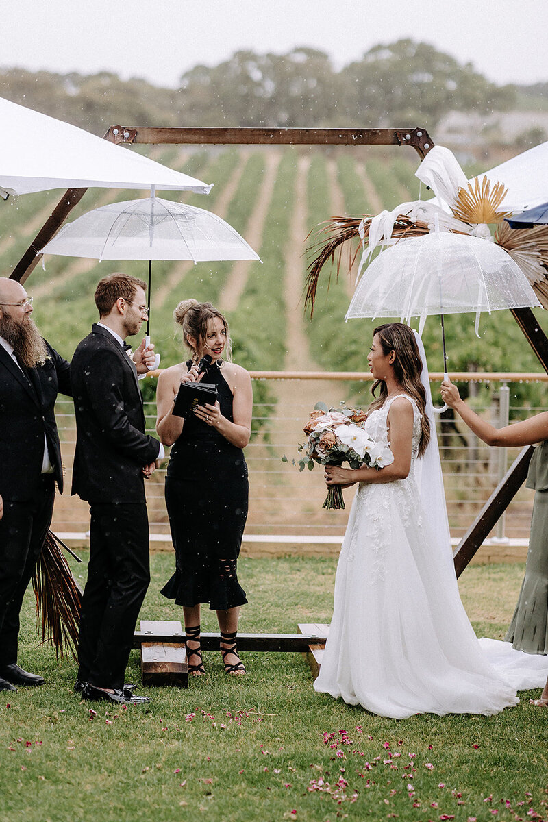 BECCY BROOKS CELEBRANT SOUTH AUSTRALIA WEDDINGS, B+K, PHOTO BY IN THE MOOD FOR LOVE PHOTOGRAPHY, RAIN UMBRELLA FUN MARRIAGE