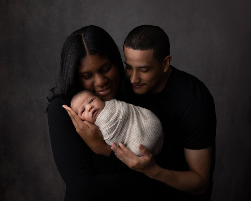 Editorial maternity session with mom in white button down shirt.