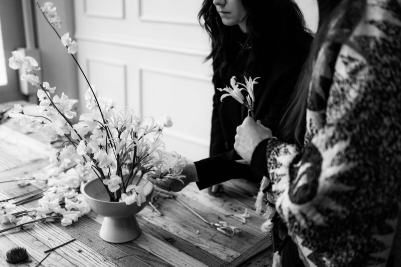 Wedding florist team designing modern centerpiece together in Seattle, Washington