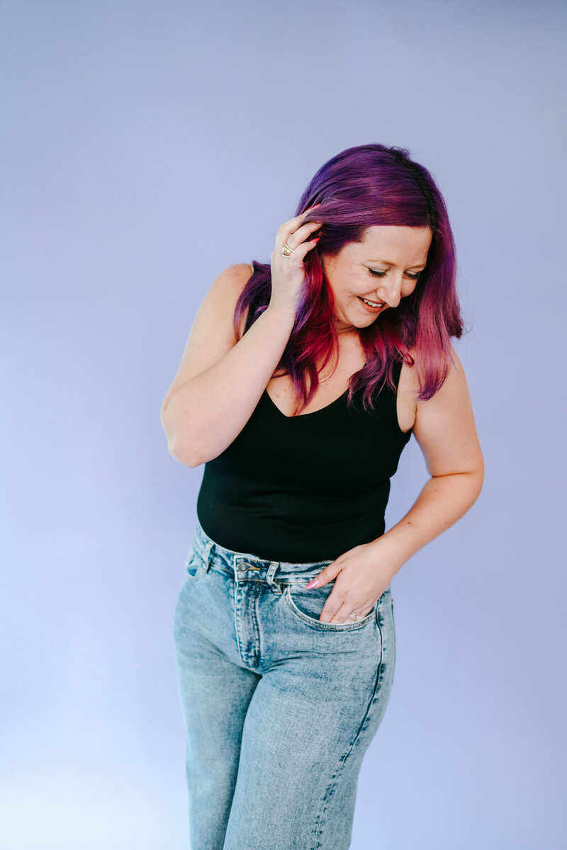 Photography Coaching | Karinda K | Woman posing with a purple background studio