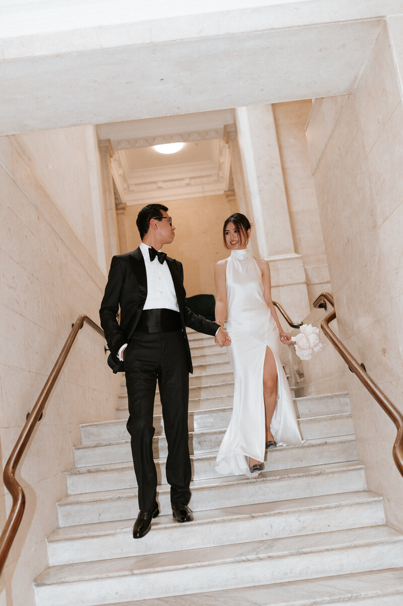 Modern wedding couple walking hand in hand outside Finca Morneta in Mallorca Spain