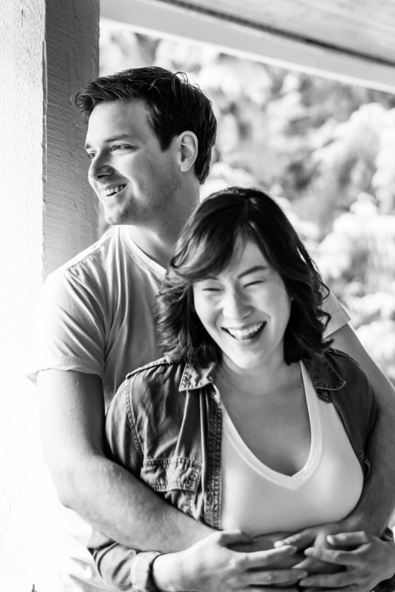 Couple laughing together on porch