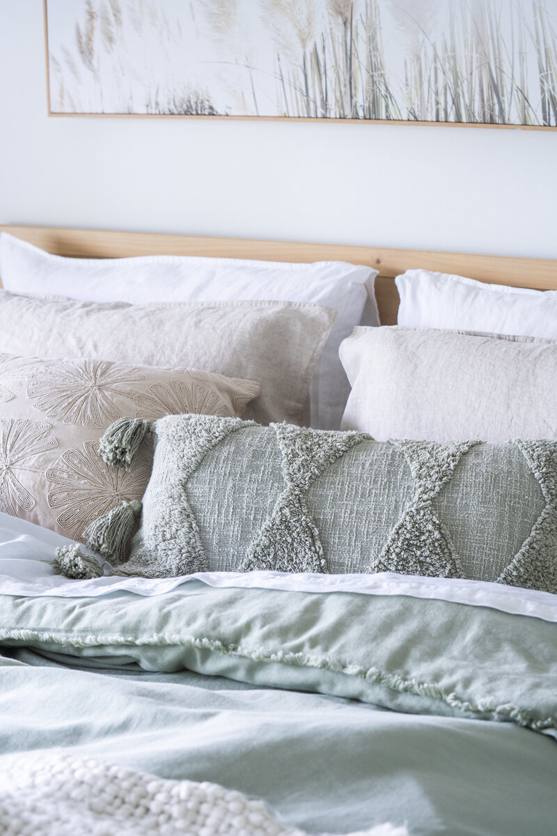Relaxed bedroom styled for Airbnb listing by interior decorator service in Sunshine Coast.