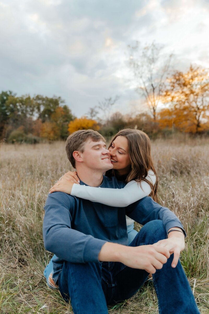 Romantic fall couples session captured by a Michigan Ohio couples photographer, perfect for candid outdoor engagement or anniversary photos in the Midwest.