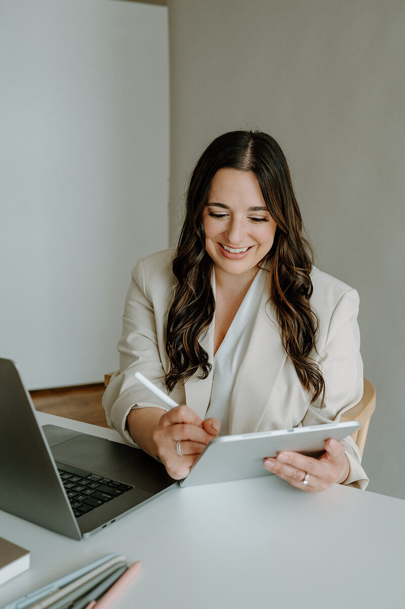 Brand and Showit website designer in Fort Wayne, IN sitting in a chair