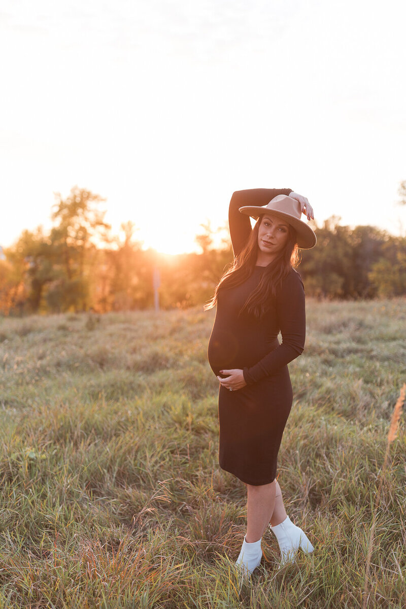 pregnant mom posing for the camera outdoors