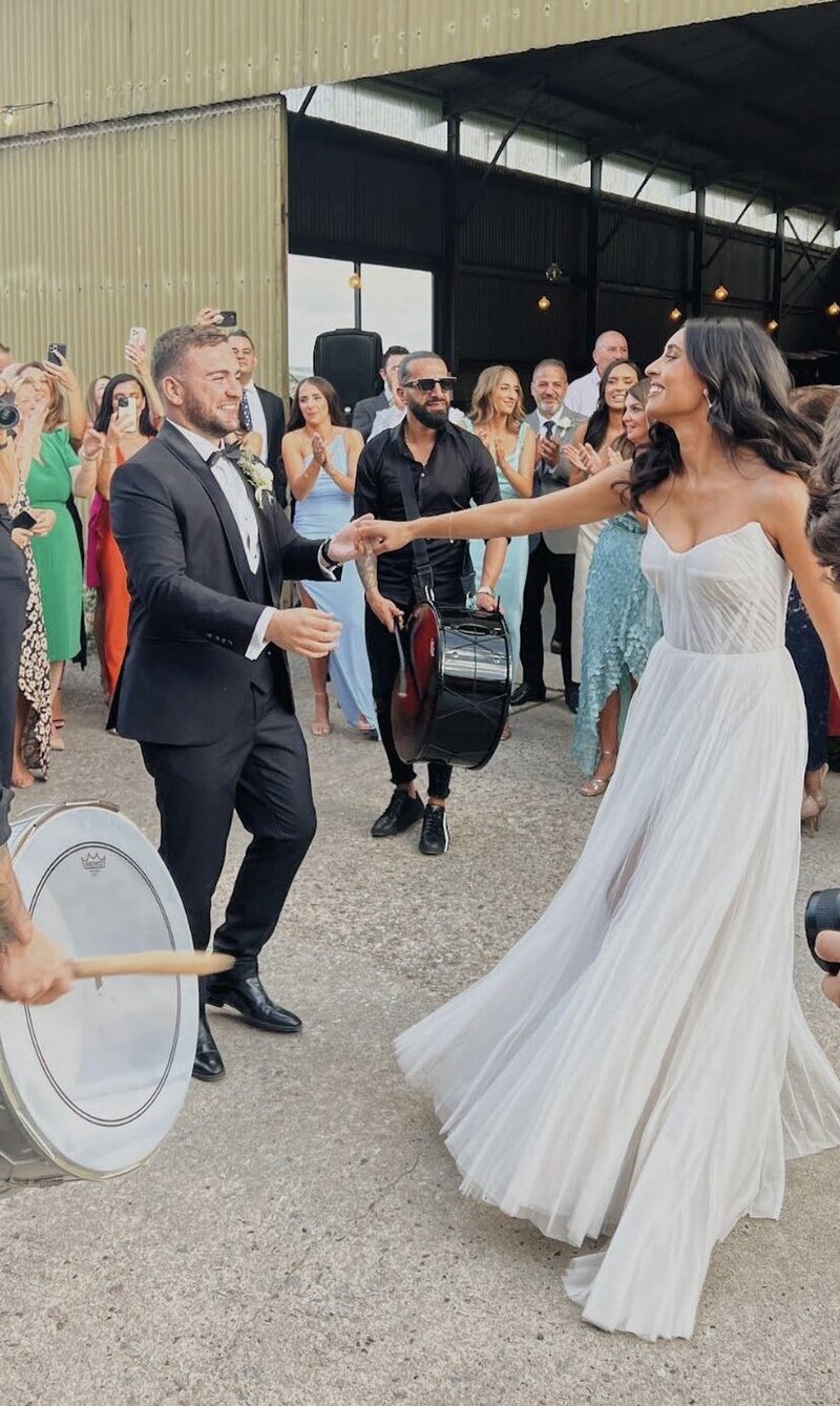 Dynamic couple enjoying their first dance, showcasing LIMCO’s ability to infuse fun and tailored choreography into wedding celebrations.