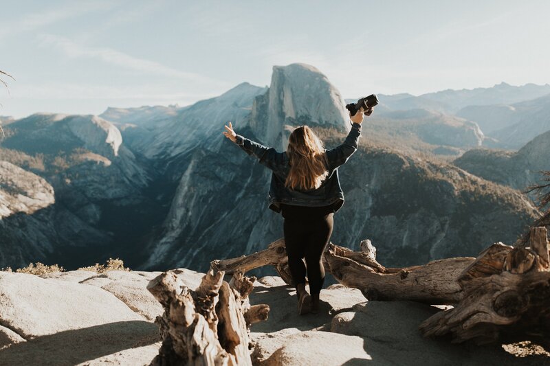 woman standing on the mountaintop