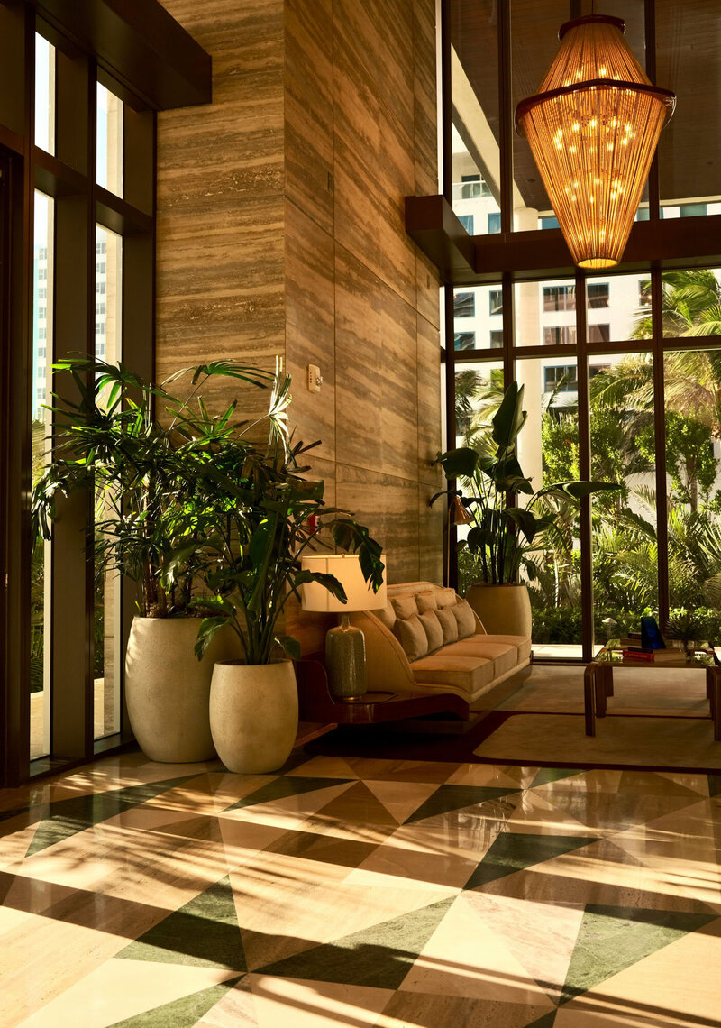Living room with a couch and potted plants