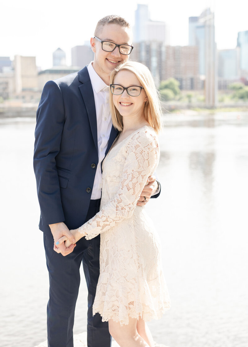wedding-photographer-and-her-husband-pose-for-a-formal-portrait
