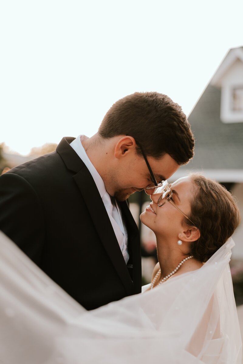 bride and groom embrace at wedding in peoria il