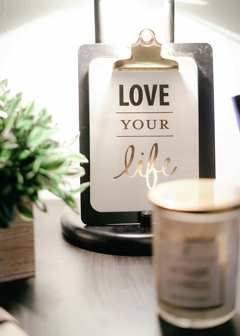 Scented candle on desk in nourishing office space